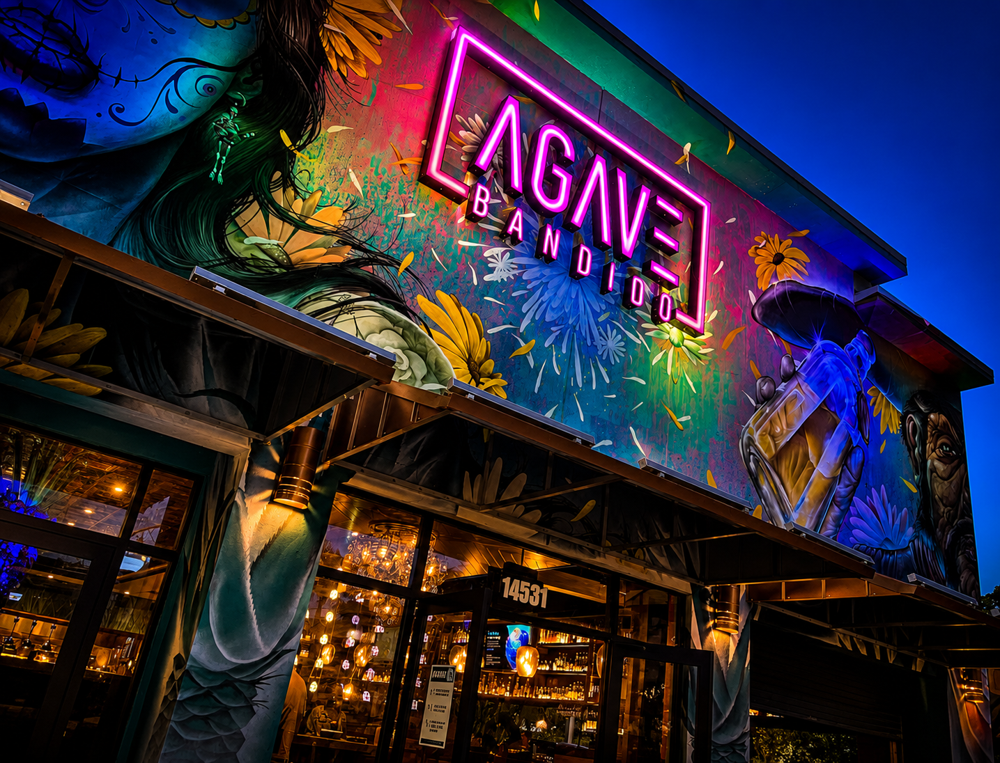 Agave Bandido exterior neon mural at night